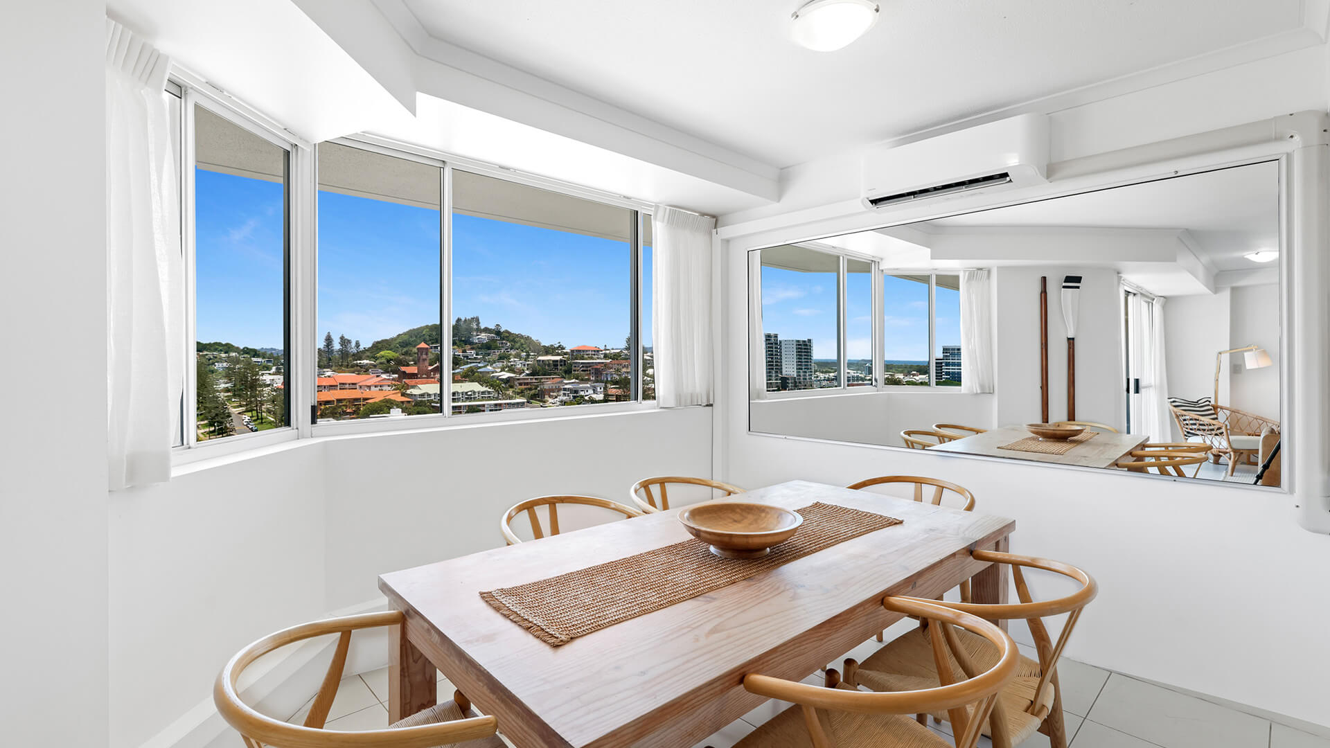 Dining area in the 2 Bedroom Pool View Apartment at ULTIQA Points North with bright windows and scenic views.