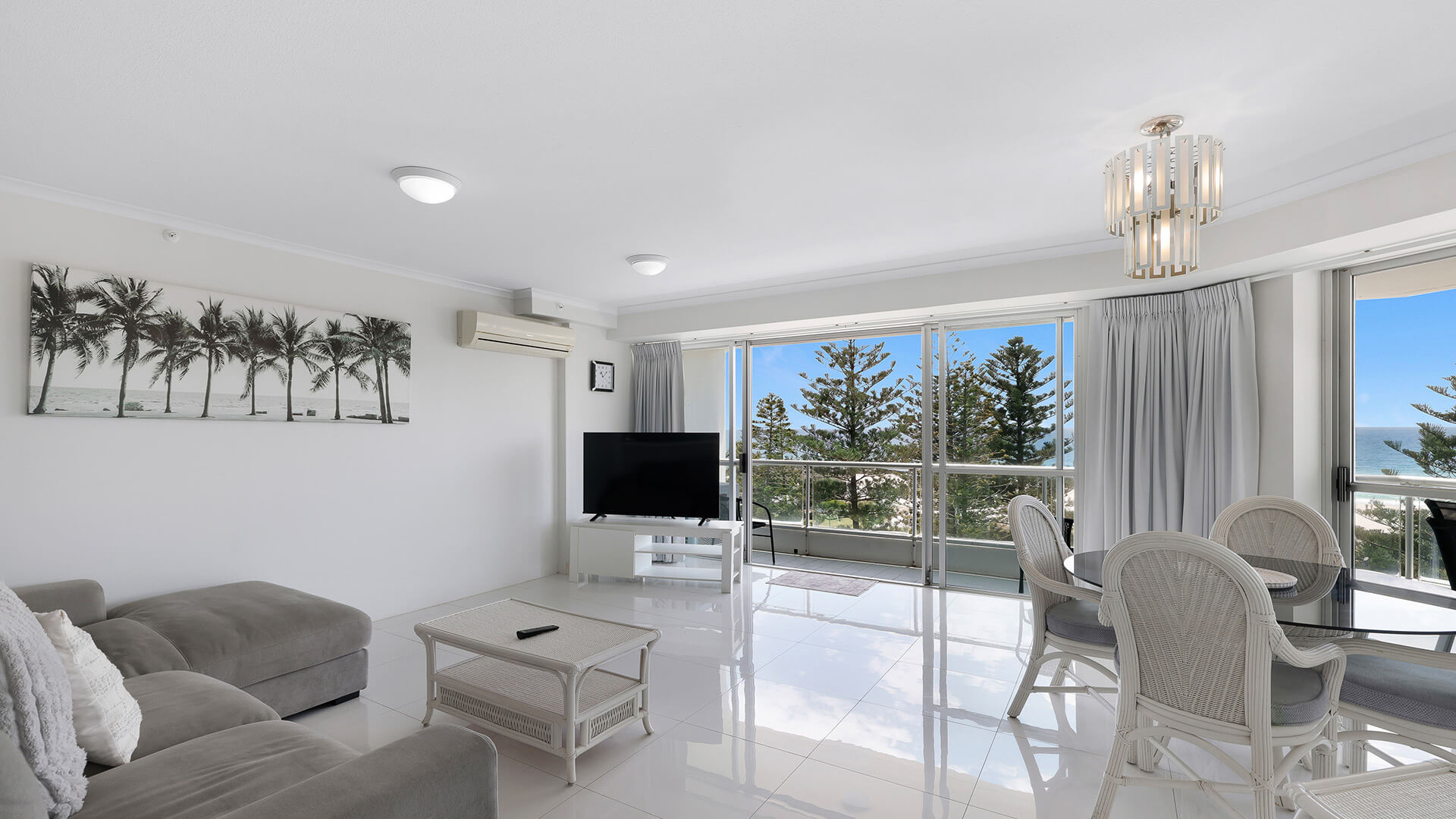 Spacious living and dining area with ocean views in the Standard 2 Bedroom Centre Front Apartment.