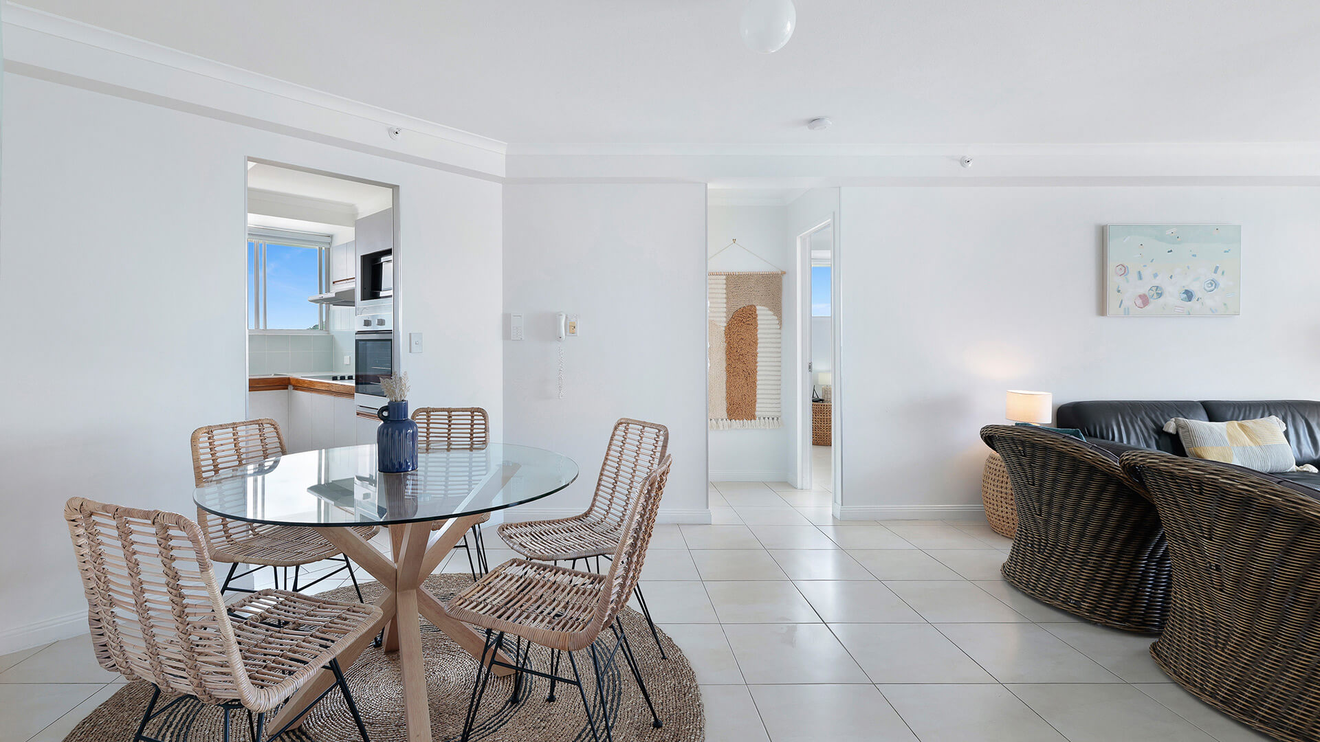Dining area in the Standard 2 Bedroom Ocean View Apartment at ULTIQA Points North, with access to the kitchen and bedrooms.