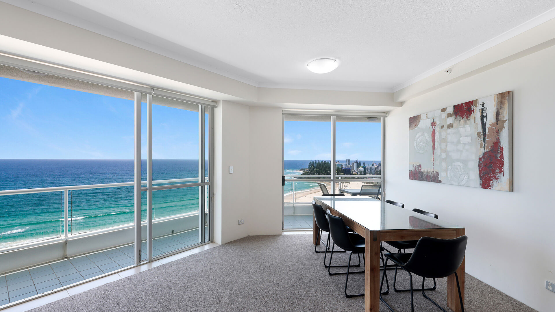 Dining area with uninterrupted ocean views in the Deluxe 2 Bedroom Centre Front Apartment at ULTIQA Points North.