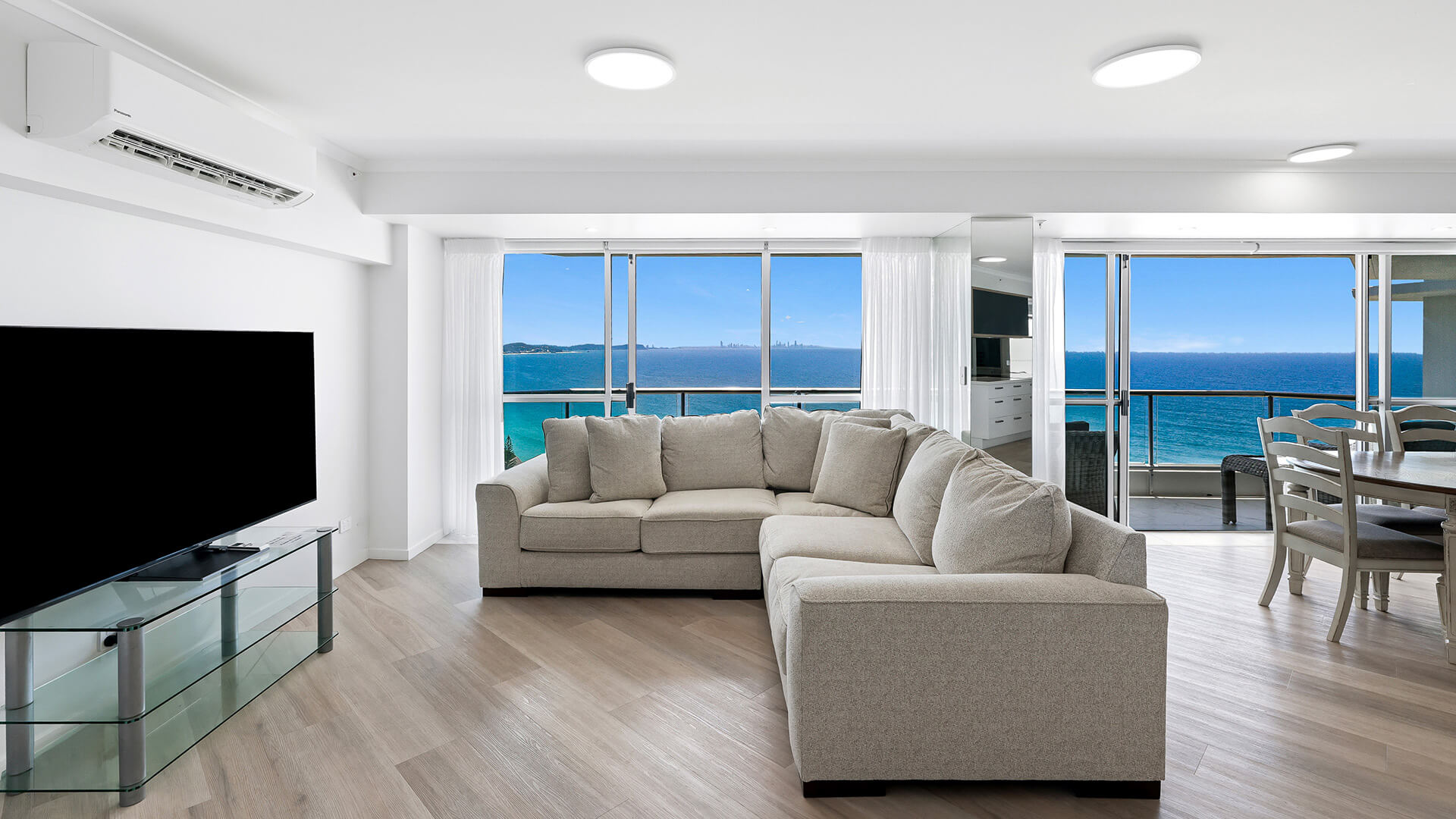 Spacious living area with ocean views in the Deluxe 3 Bedroom Ocean View Apartment at ULTIQA Points North Coolangatta.