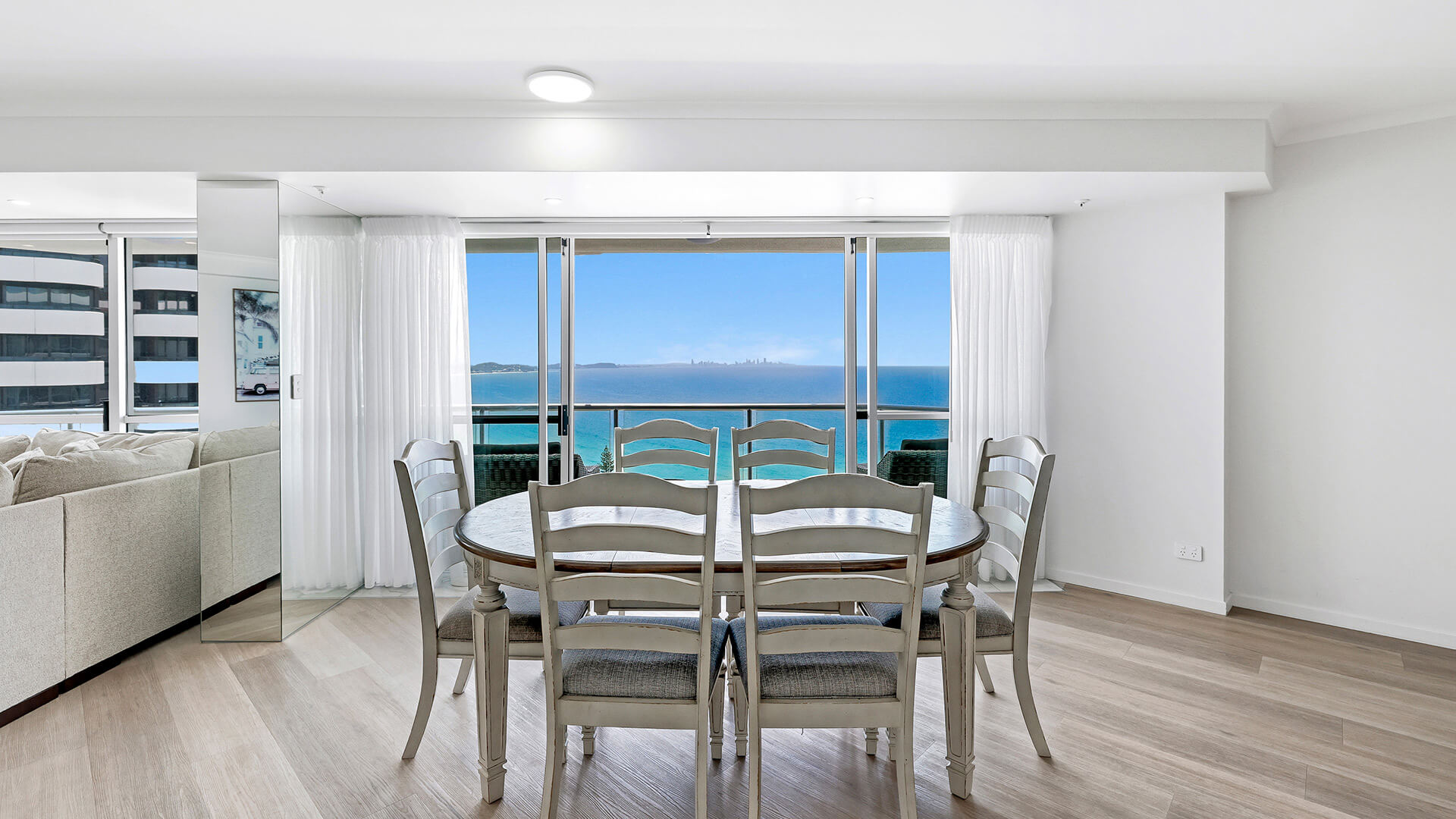 Dining area with ocean views in the Deluxe 3 Bedroom Ocean View Apartment at ULTIQA Points North Coolangatta.