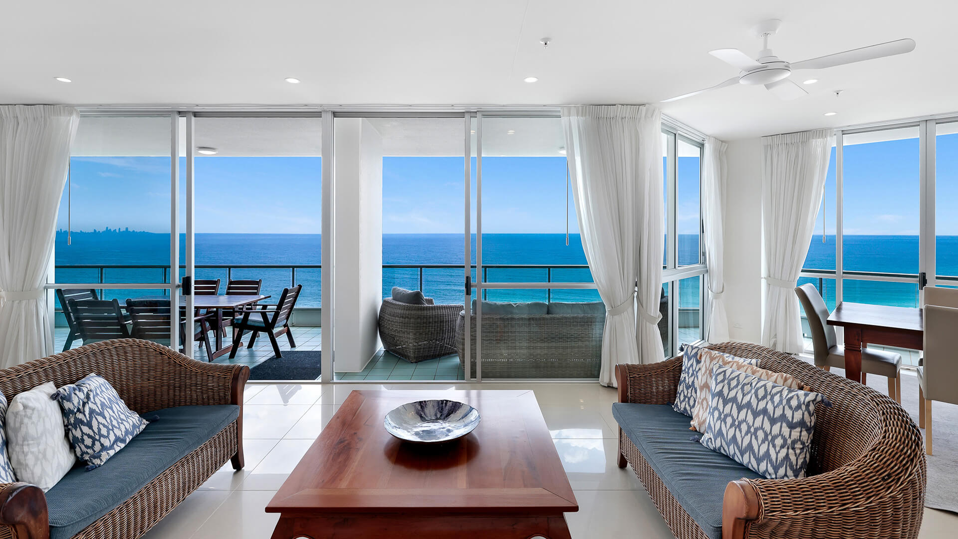 Living area of the 4 Bedroom Oceanfront Penthouse at ULTIQA Points North with balcony and ocean views.