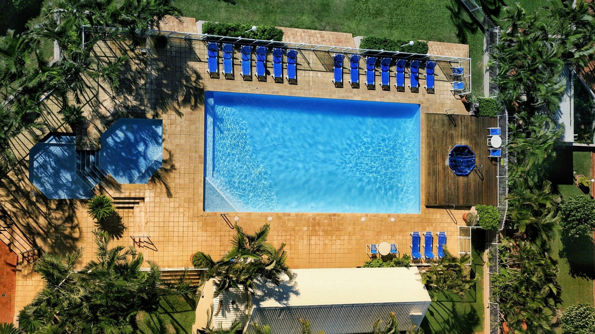 ULTIQA Points North. Arial View of Swimming Pools, Deck and Seating Area.
