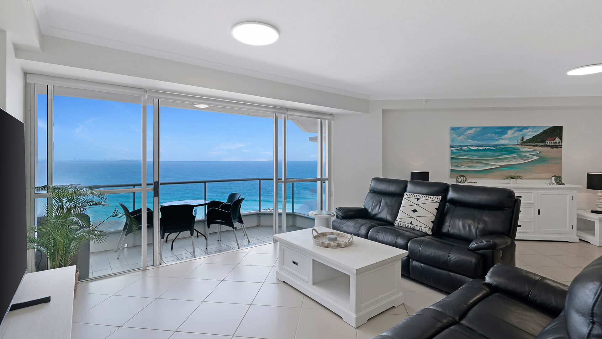 Spacious oceanfront lounge area with furnished patio & Ocean Views in the Superior 1 Bedroom Ocean View Apartment at ULTIQA Points North.