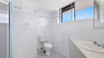 Bathroom in the Standard 2 Bedroom Ocean View Apartment at ULTIQA Points North, featuring a shower and vanity.