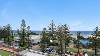 Oceanfront view from the Standard 2 Bedroom Centre Front Apartment at ULTIQA Points North, overlooking parklands and Coolangatta Beach.