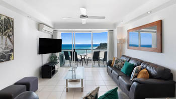 Spacious oceanfront lounge area with furnished patio & Ocean Views in the Superior 1 Bedroom Ocean View Apartment at ULTIQA Points North.