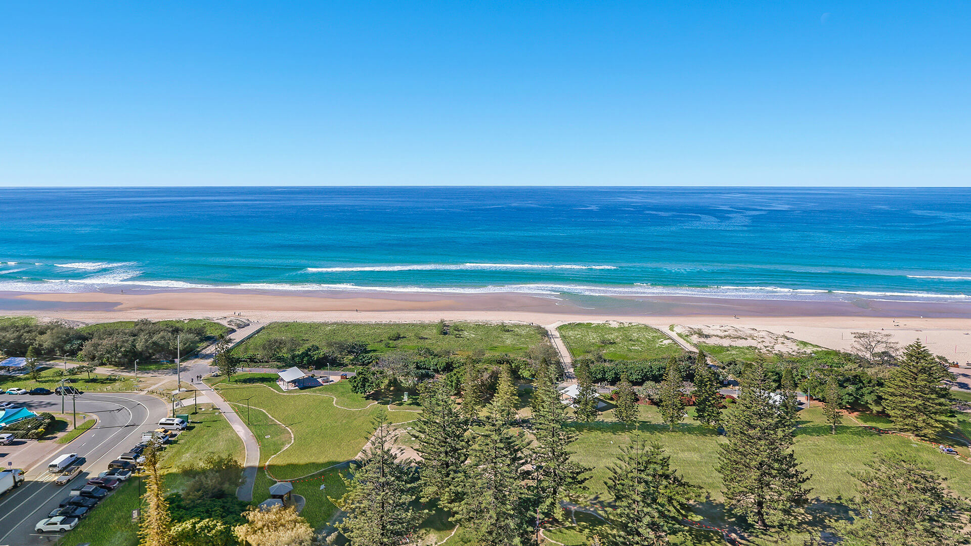 Elevated beachfront outlook across sand and ocean at ULTIQA Beach Haven, Surfers Paradise, Gold Coast