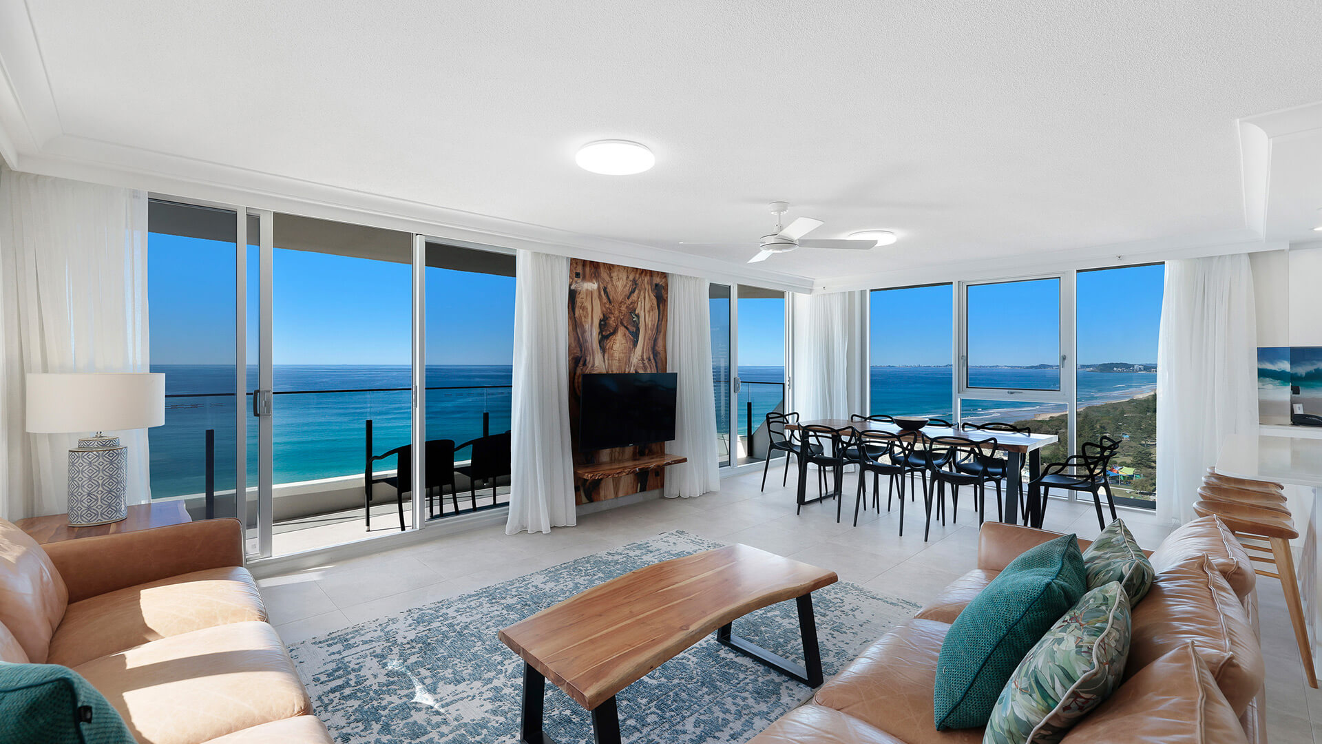 Open-plan lounge and dining with wraparound ocean outlook at ULTIQA Beach Haven, Gold Coast