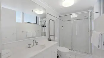 Main bathroom with walk-in shower and large vanity in the 2 Bedroom Apartment at ULTIQA Beach Haven on Broadbeach.