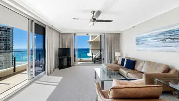 Living room in the 2 Bedroom Ocean View Apartment at ULTIQA Beach Haven on Broadbeach with leather seating and panoramic ocean views.