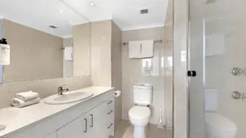 Bathroom in the 2 Bedroom Ocean View Apartment at ULTIQA Beach Haven on Broadbeach with glass shower, vanity, and modern finishes.
