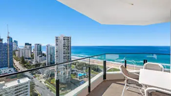 Outdoor dining setting on the balcony in the 2 Bedroom Ocean View Apartment at ULTIQA Beach Haven on Broadbeach with panoramic views of the Gold Coast skyline and golden beachfront.