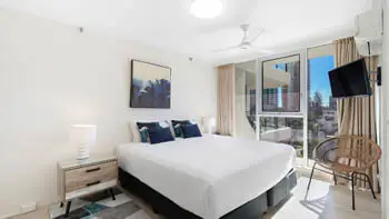 Master bedroom in the 2 Bedroom Ocean View Apartment at ULTIQA Beach Haven on Broadbeach with king bed and natural light.