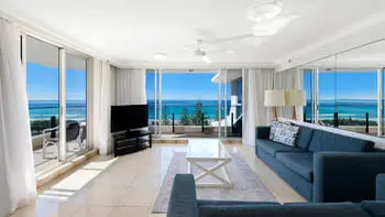 Living area with ocean views in the Standard 2 Bedroom Ocean View Apartment at ULTIQA Beach Haven on Broadbeach.
