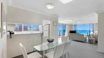 Open-plan dining and lounge area with ocean views in the Standard 2 Bedroom Ocean View Apartment at ULTIQA Beach Haven on Broadbeach.
