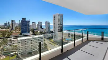 Spacious balcony with panoramic ocean and skyline views at the Standard 2 Bedroom Ocean View Apartment at ULTIQA Beach Haven on Broadbeach.