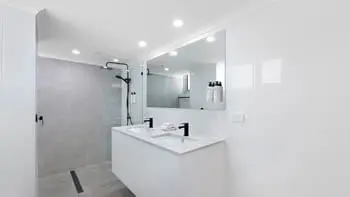 Bathroom in the Premium 2 Bedroom Ocean View Apartment at ULTIQA Beach Haven on Broadbeach, featuring a walk-in shower and dual vanity.
