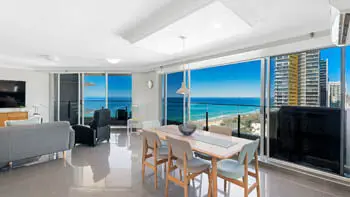 Dining area with panoramic ocean views and floor-to-ceiling windows in the Premium 2 Bedroom Ocean View Apartment at ULTIQA Beach Haven on Broadbeach.