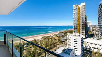 Expansive balcony view overlooking the sparkling ocean and golden sands of Broadbeach.