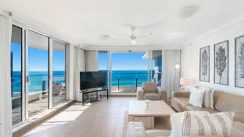 Bright lounge with floor-to-ceiling glass and beachfront views at ULTIQA Beach Haven on Broadbeach, Surfers Paradise.
