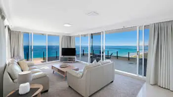Dining and lounge area with stunning ocean views in the Sub Penthouse at ULTIQA Beach Haven on Broadbeach.