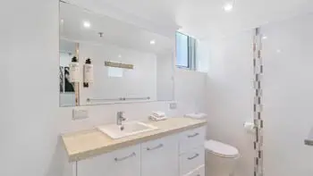 Bright bathroom with walk-in shower in the Sub Penthouse at ULTIQA Beach Haven on Broadbeach.