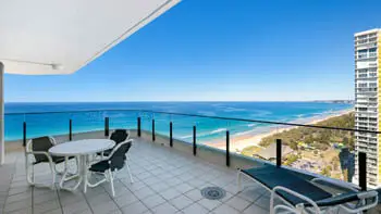 Expansive balcony in the Sub Penthouse at ULTIQA Beach Haven on Broadbeach, featuring outdoor dining and uninterrupted ocean views.
