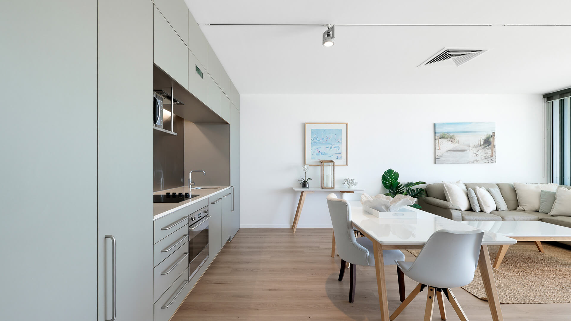 Modern kitchen and dining area in 1 Bedroom Ocean View Apartment at ULTIQA Air on Broadbeach.