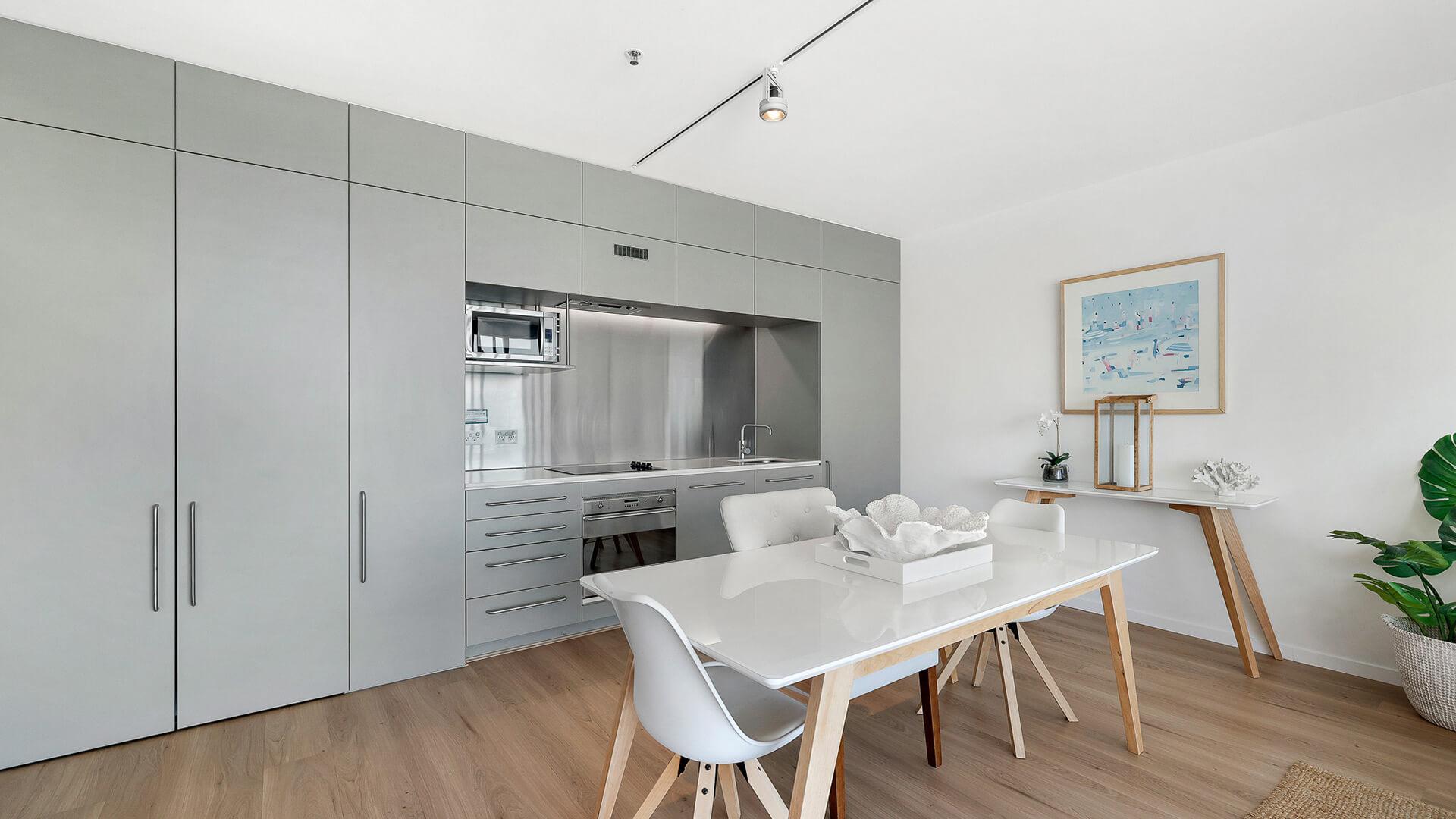 Fully equipped kitchen and dining area in 1 Bedroom Ocean View Apartment at ULTIQA Air on Broadbeach.