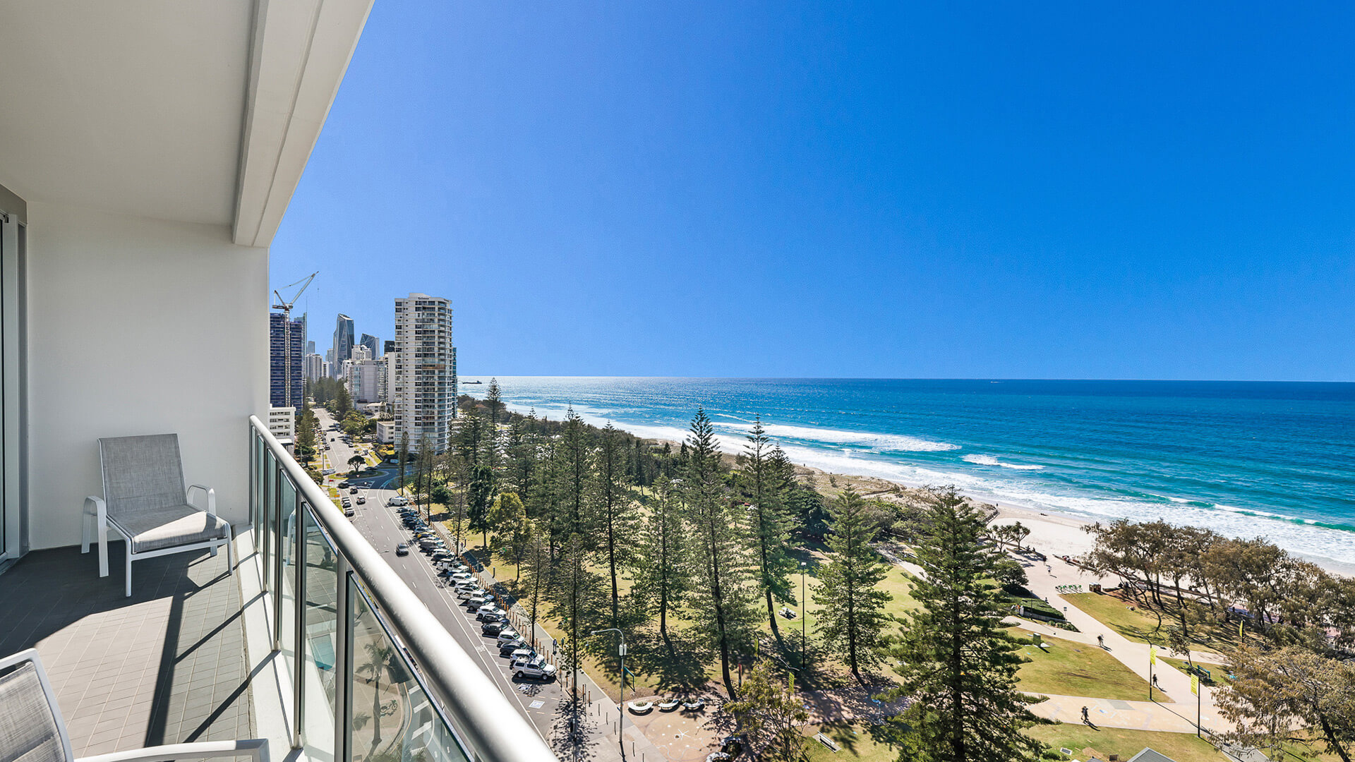 Balcony with seating and coastal views from 1 Bedroom Ocean View Apartment at ULTIQA Air on Broadbeach.