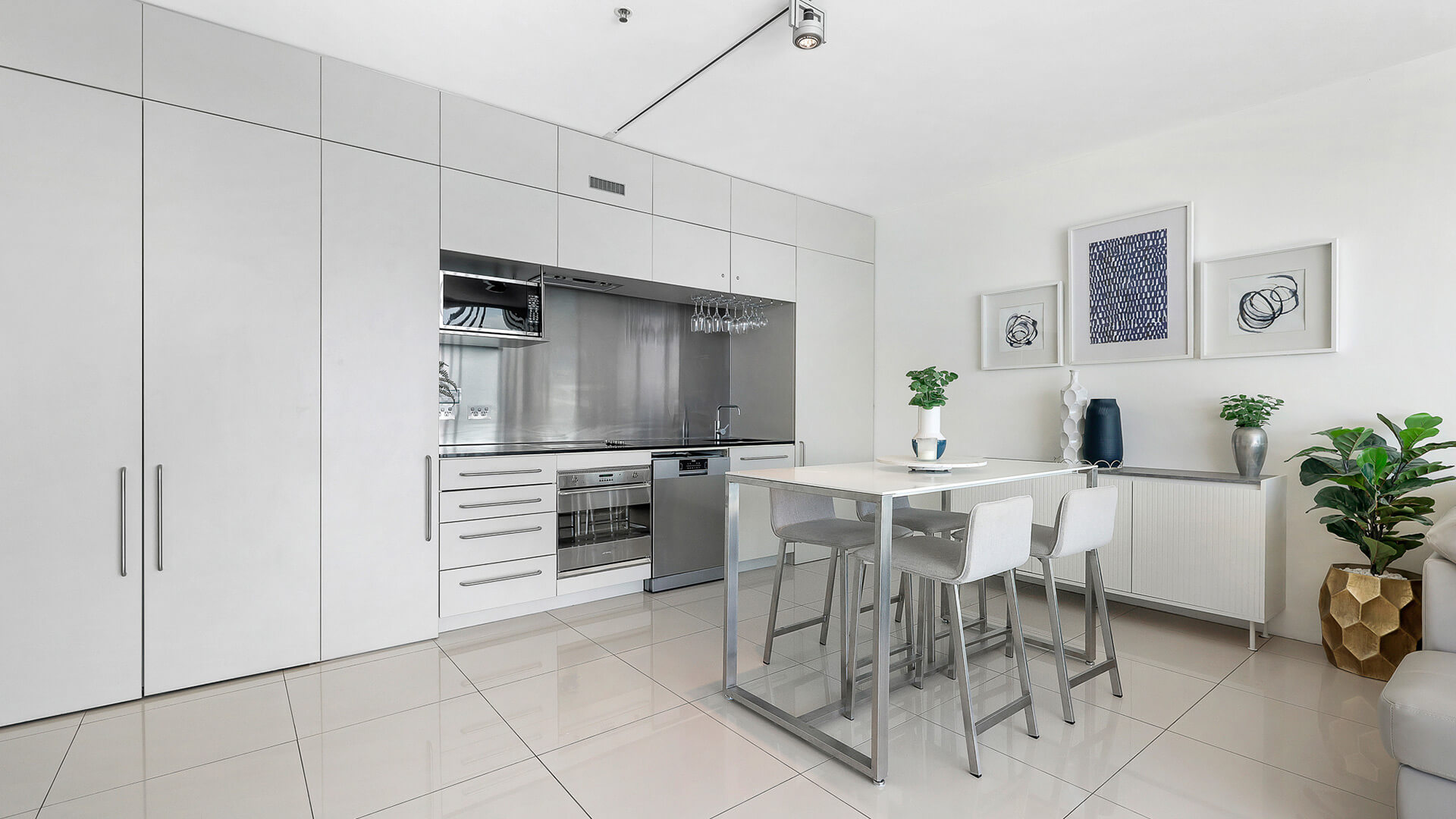 Modern kitchen and dining area in 1 Bedroom Ocean View Apartment at ULTIQA Air on Broadbeach.