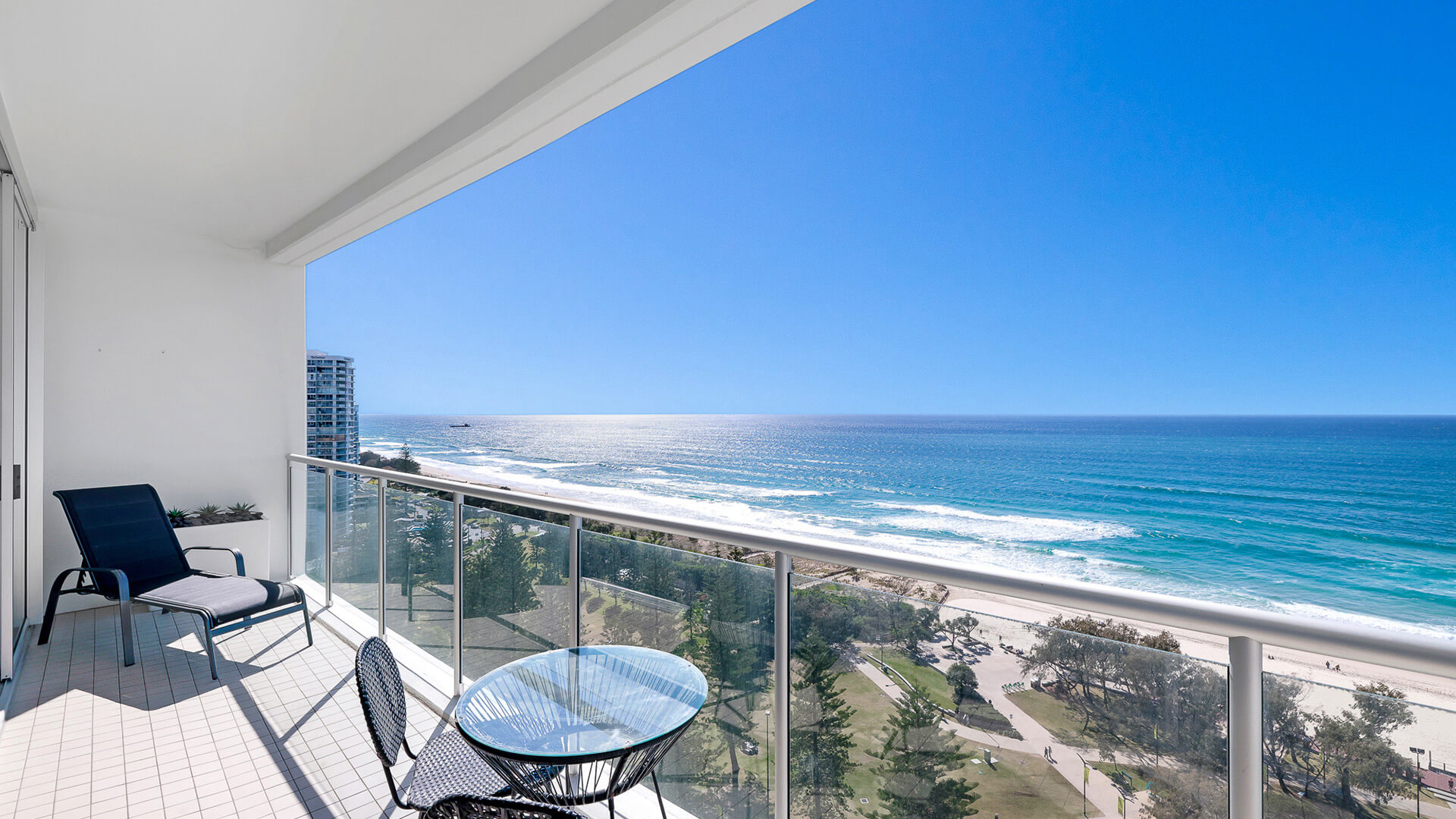 Private balcony with seating and ocean views in 1 Bedroom Ocean View Apartment at ULTIQA Air on Broadbeach.