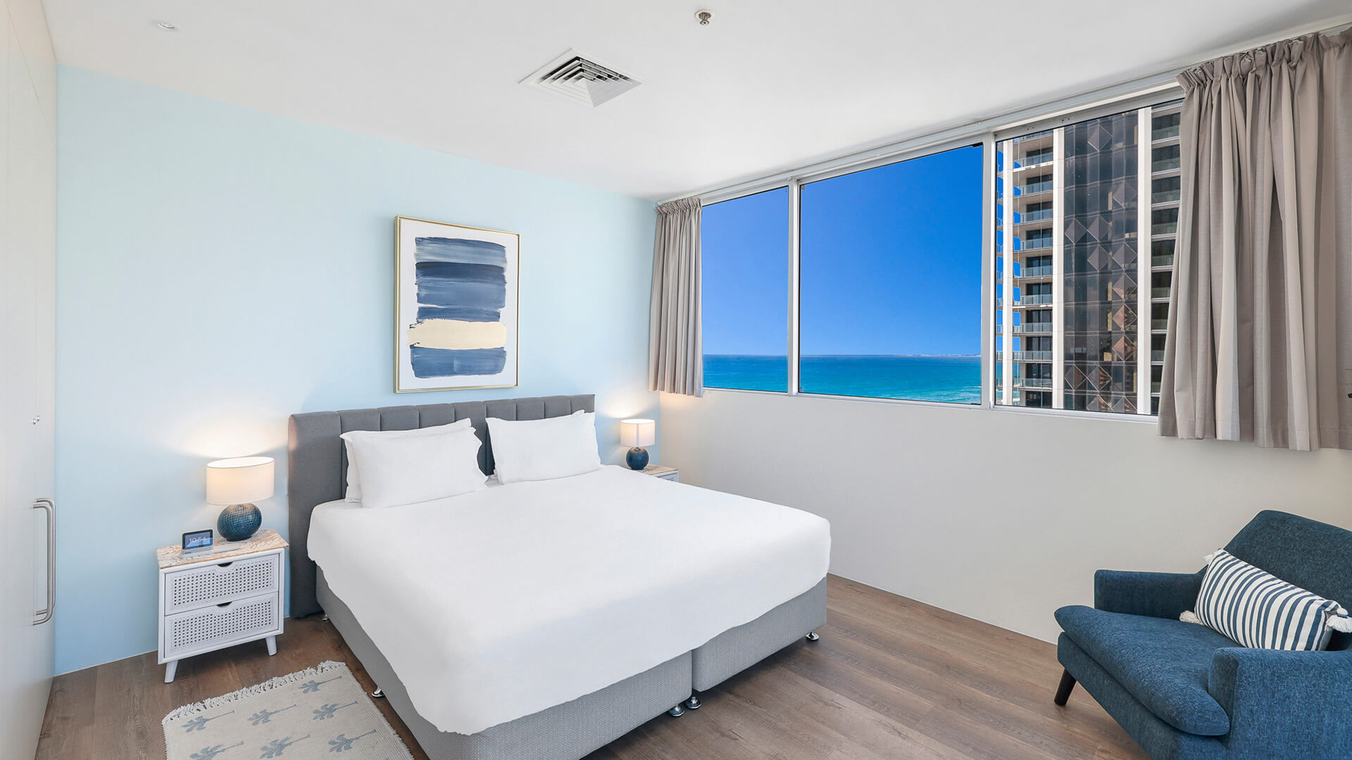 Bedroom with king bed, ocean views, and modern coastal decor in 2 Bedroom Gold Coast View Suite at ULTIQA Air on Broadbeach.