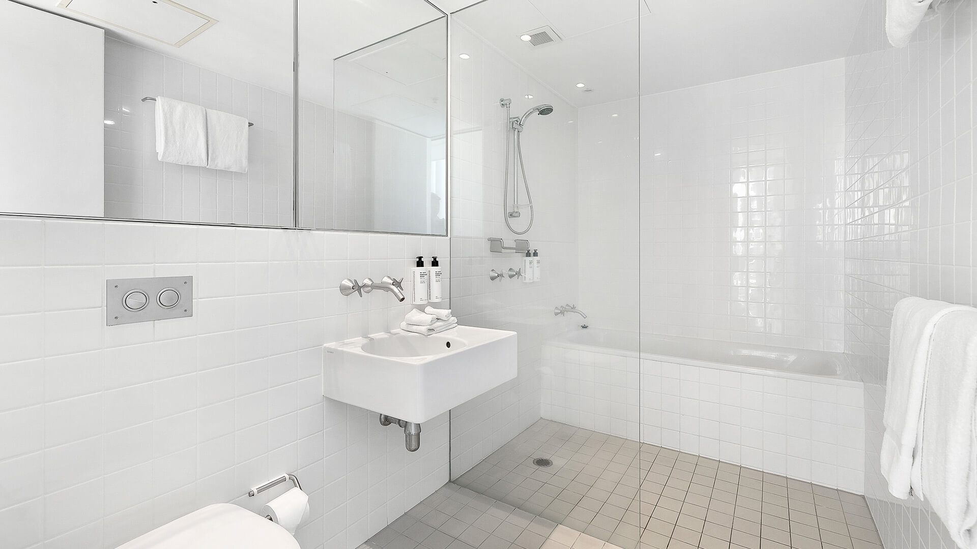 Bathroom with walk-in shower, bathtub, and vanity in 2 Bedroom Gold Coast View Suite at ULTIQA Air on Broadbeach.