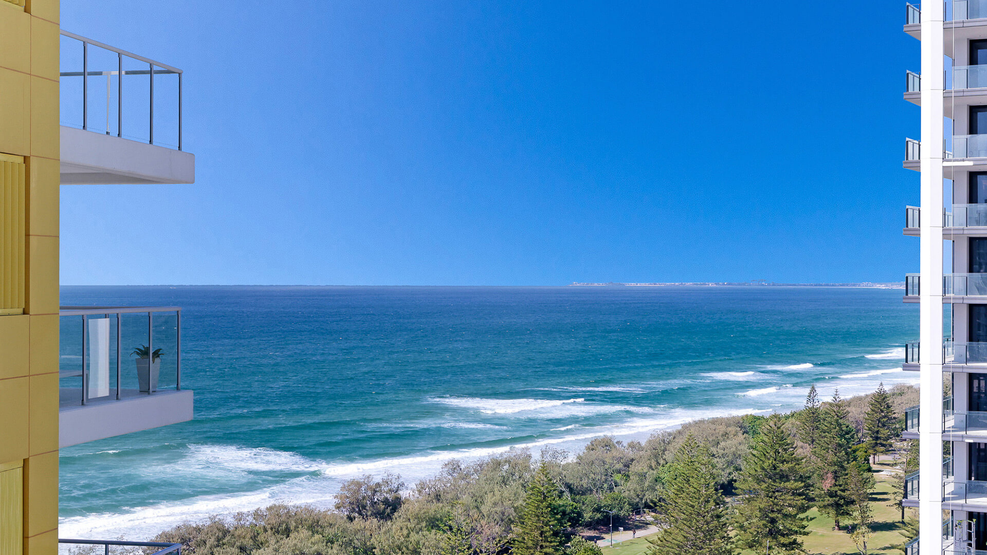 Oceanfront outlook across parklands and coastline from 2 Bedroom Gold Coast View Suite at ULTIQA Air on Broadbeach.