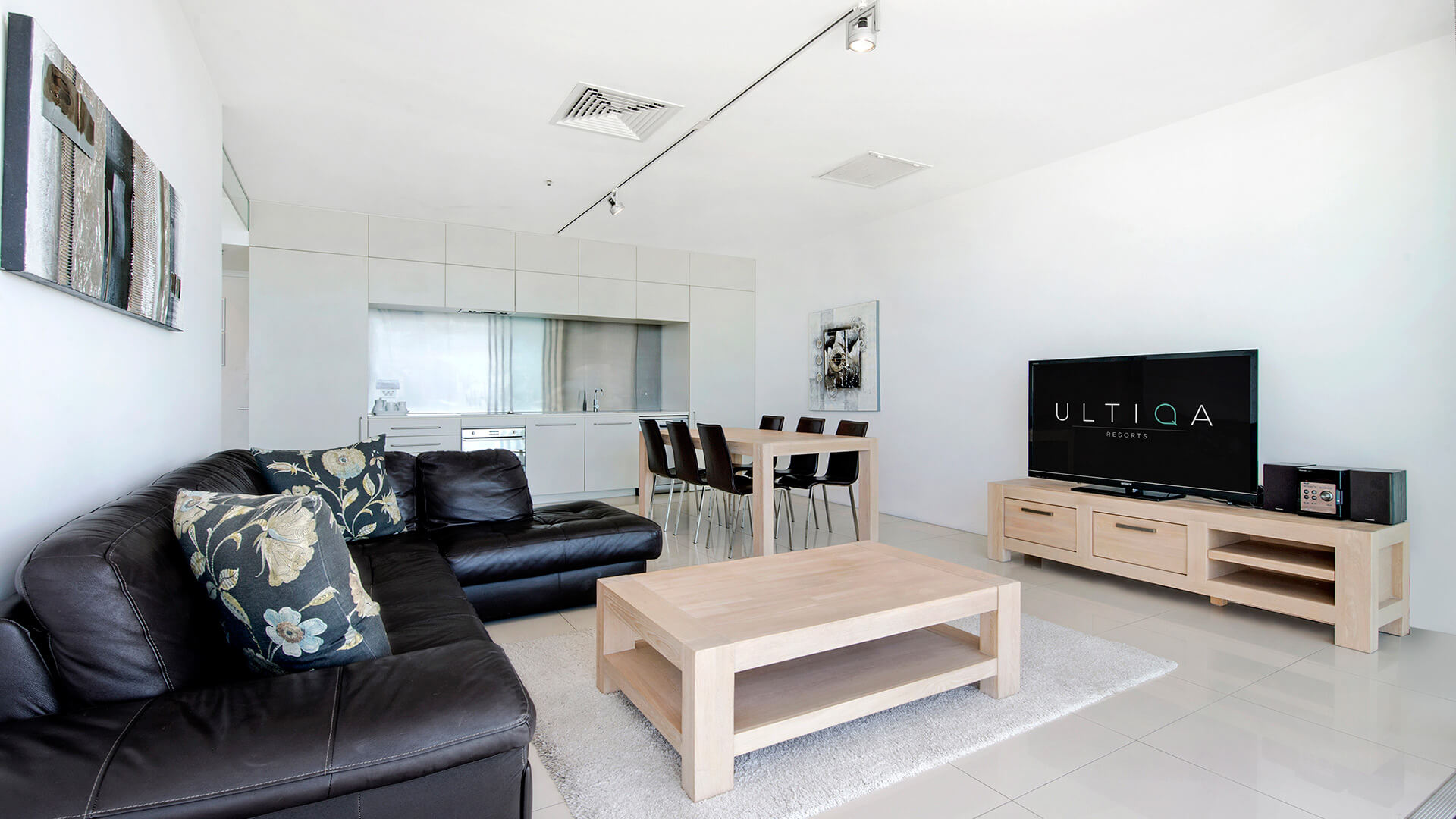 Open-plan living, dining, and kitchen area in 2 Bedroom Ocean View Apartment at ULTIQA Air on Broadbeach.