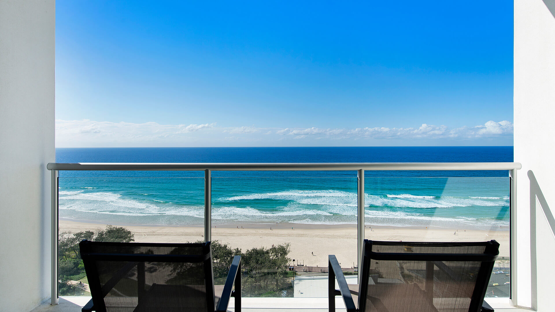 Private balcony with seating and uninterrupted ocean views in 2 Bedroom Ocean View Apartment at ULTIQA Air on Broadbeach.