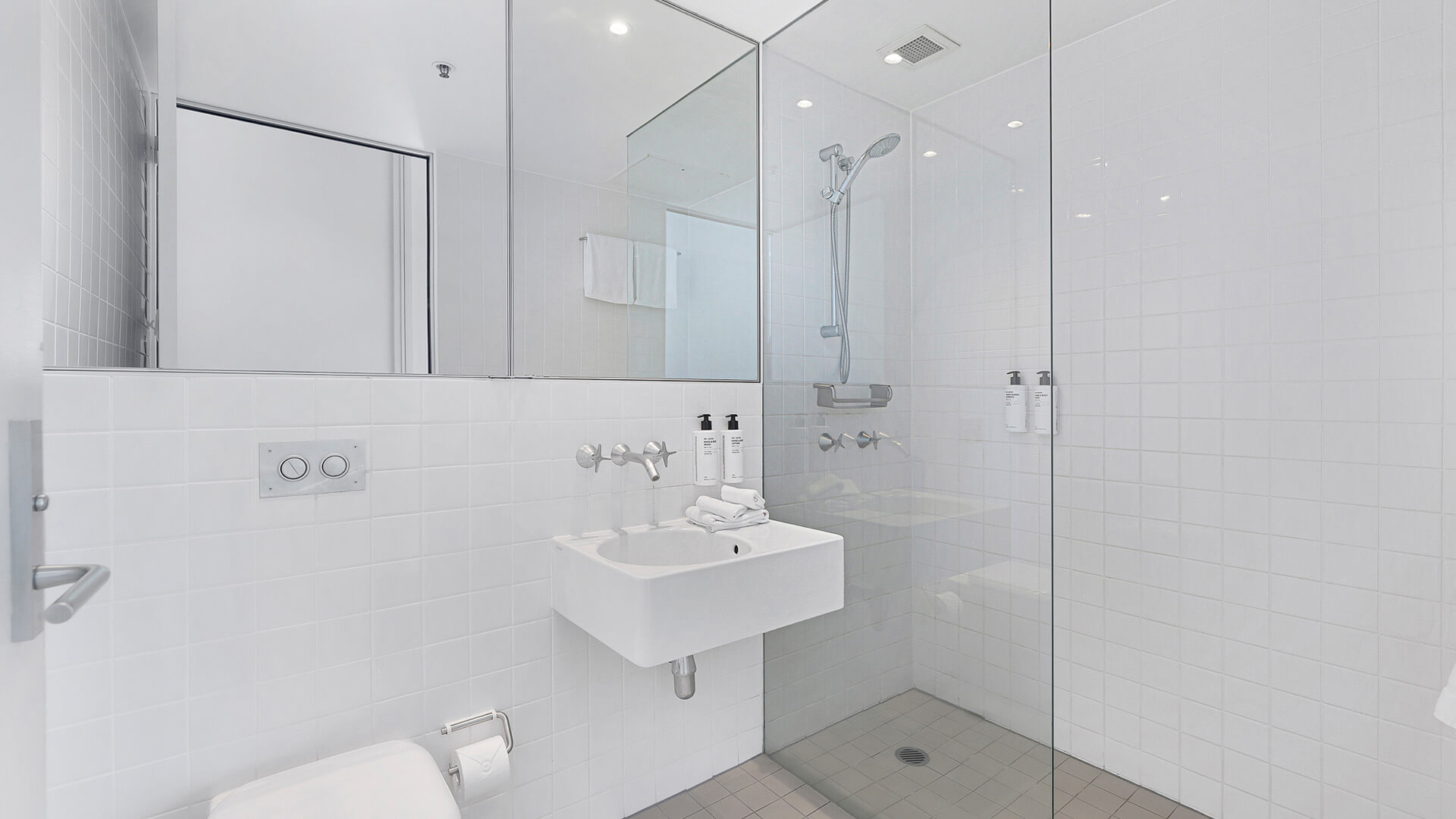 Bathroom with walk-in shower, vanity, and amenities in 2 Bedroom Ocean View Apartment at ULTIQA Air on Broadbeach.