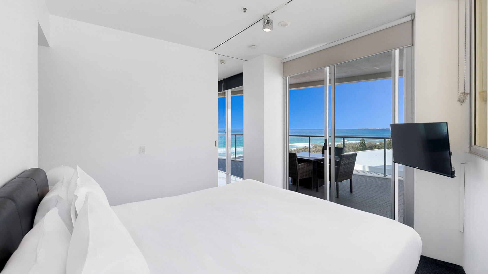 Bedroom with king bed and private balcony ocean views in 2 Bedroom Ocean View Suite at ULTIQA Air on Broadbeach.