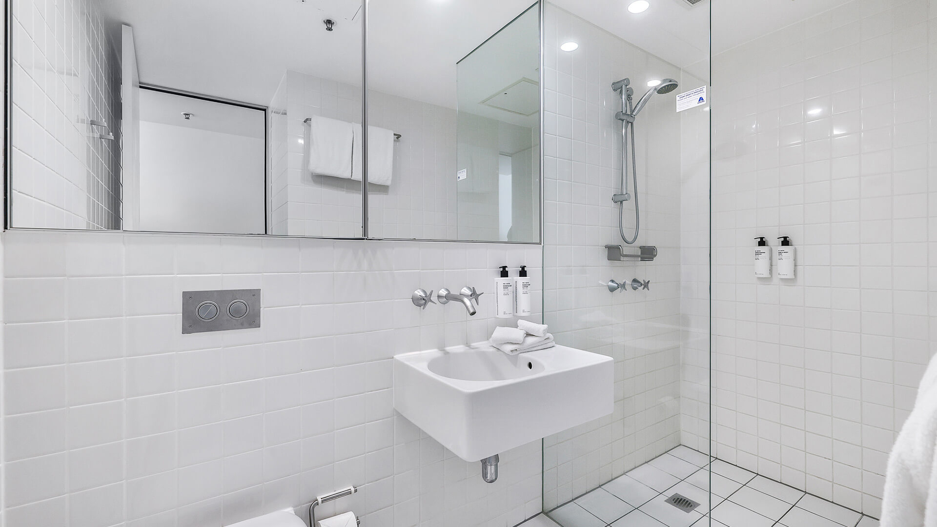 Bathroom with walk-in shower and vanity in 2 Bedroom Ocean View Suite at ULTIQA Air on Broadbeach.