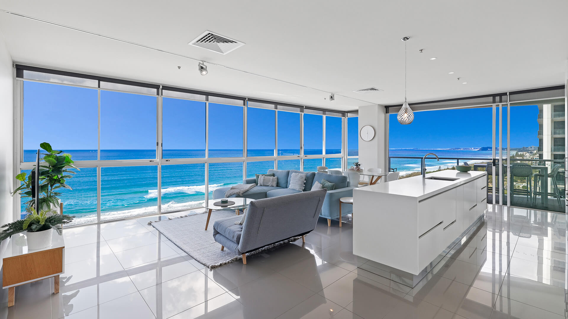 Spacious living and dining area with floor-to-ceiling ocean views in 2 Bedroom Ocean View Suite at ULTIQA Air on Broadbeach.