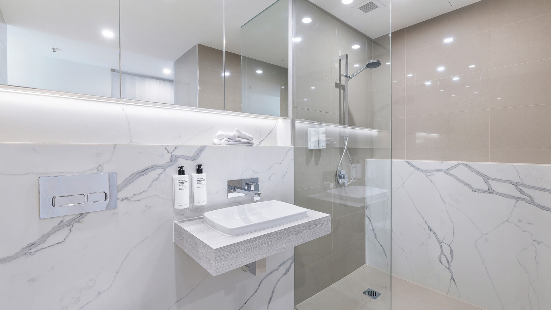 Modern bathroom with vanity and walk-in shower in 2 Bedroom Ocean View Suite at ULTIQA Air on Broadbeach.