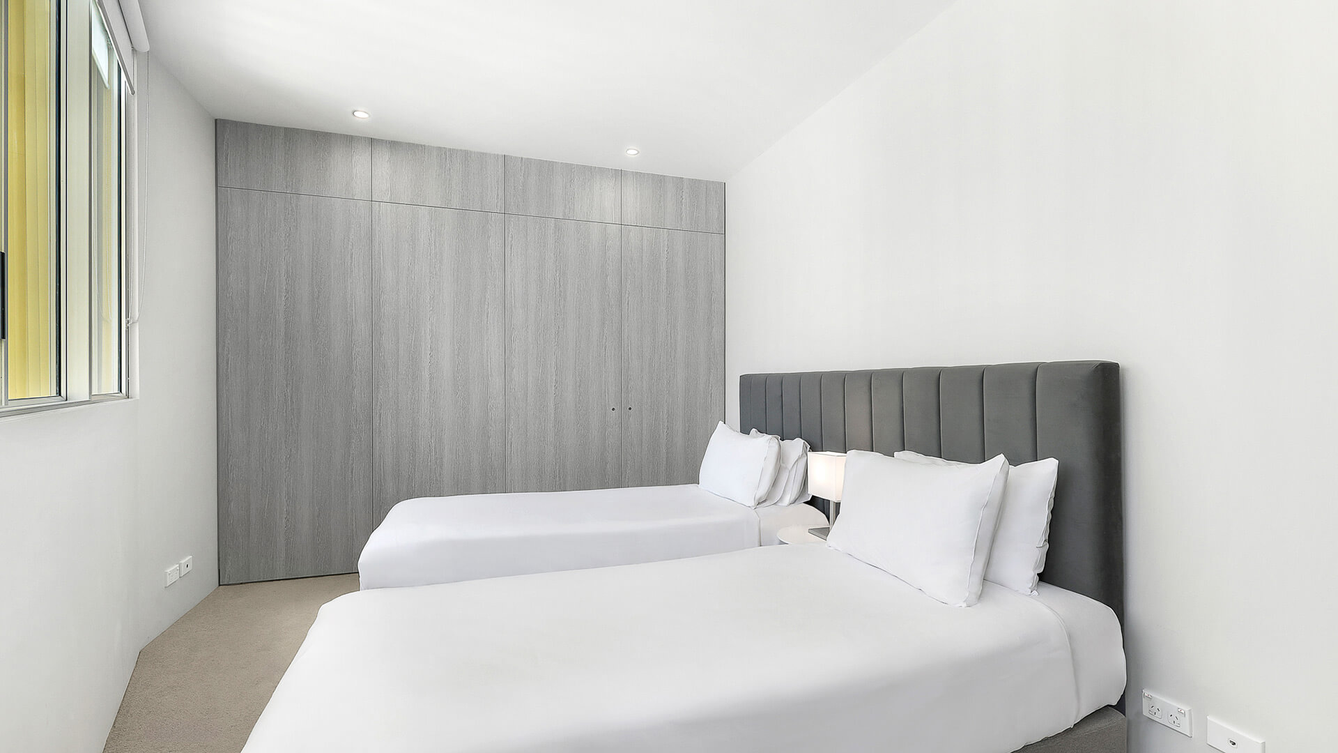 Second bedroom with twin beds in 2 Bedroom Ocean View Suite at ULTIQA Air on Broadbeach.