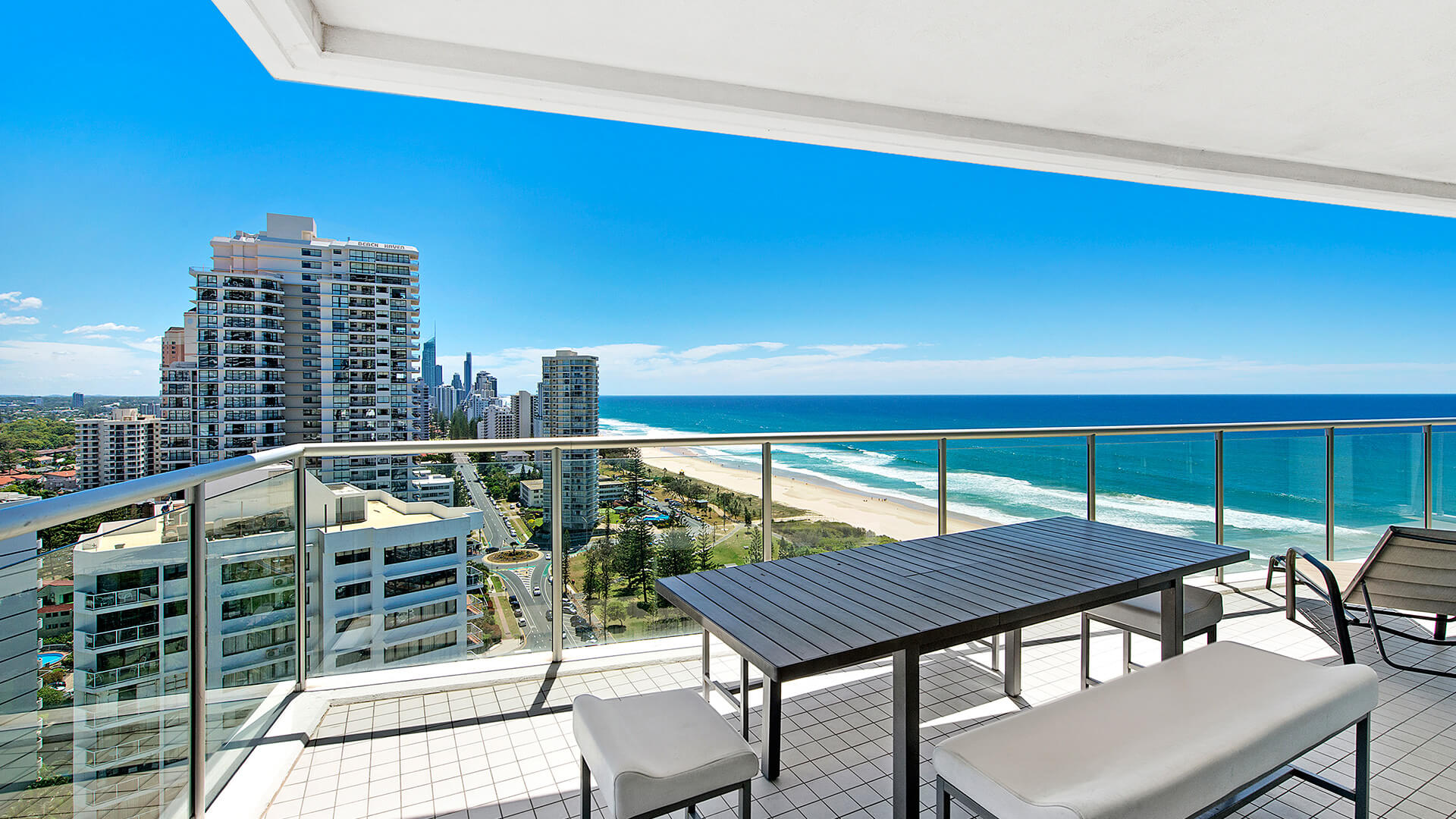 Balcony with outdoor dining and sweeping ocean views at ULTIQA Air on Broadbeach 3 Bedroom Apartment.