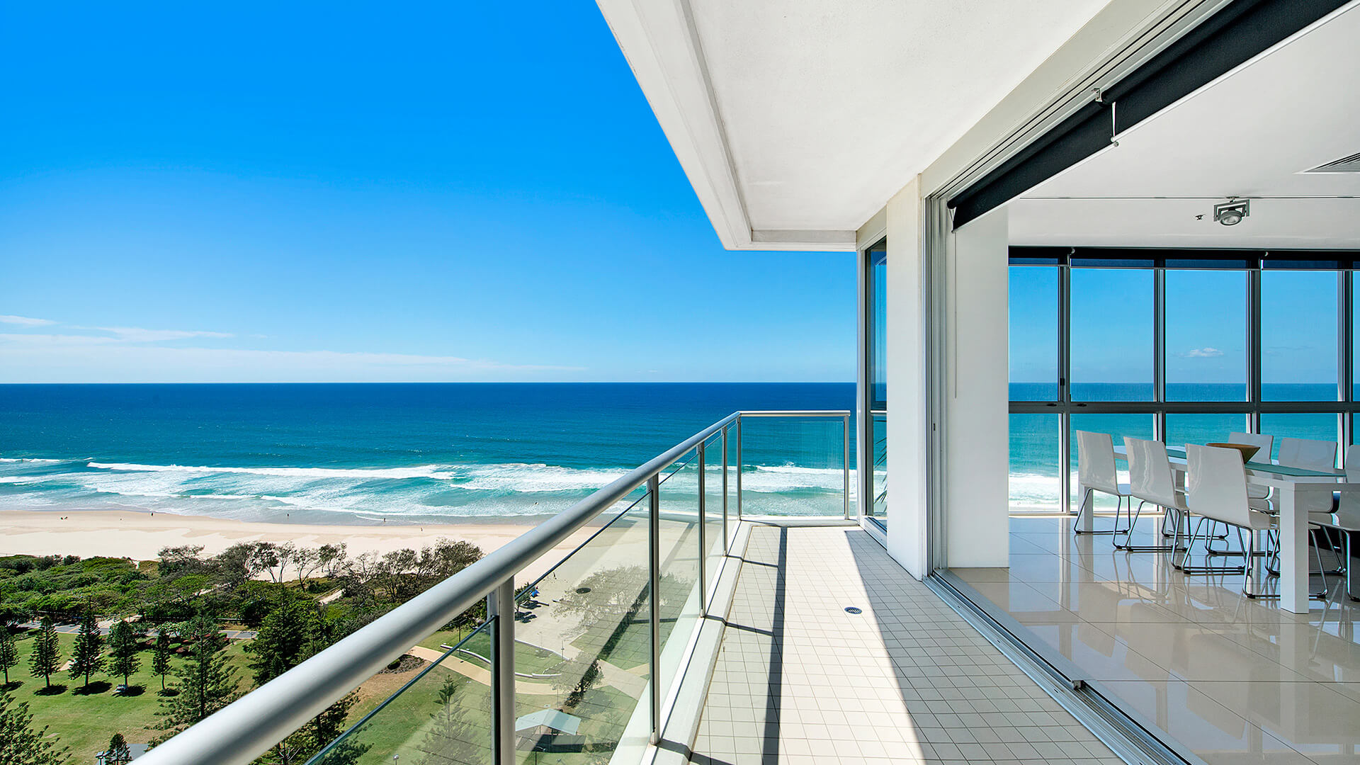Balcony with ocean views connecting to dining area in 3 Bedroom Apartment at ULTIQA Air on Broadbeach.