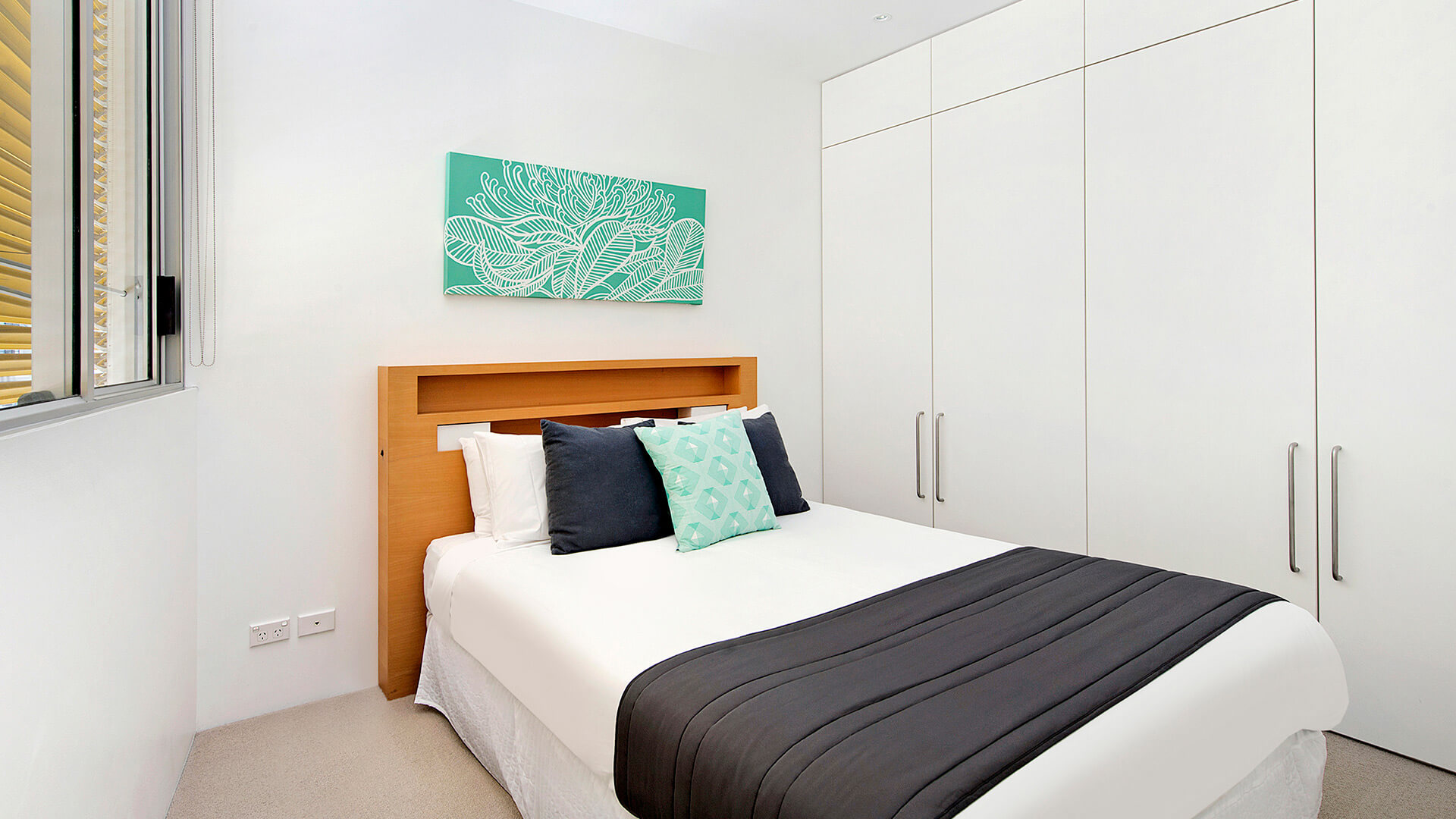 Third bedroom with queen bed in 3 Bedroom Ocean View Apartment at ULTIQA Air on Broadbeach.
