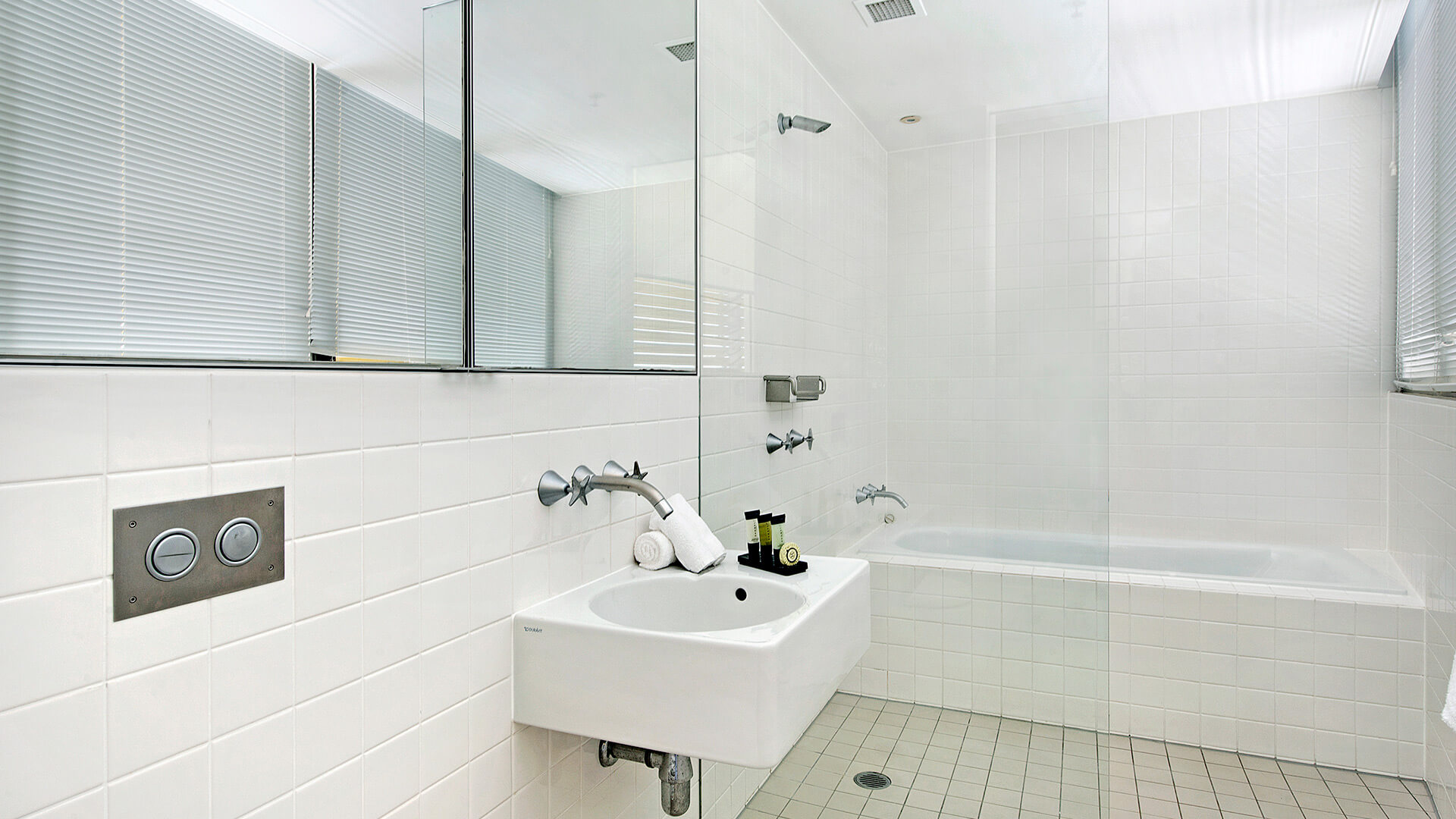 Bathroom with shower and bathtub in 3 Bedroom Ocean View Apartment at ULTIQA Air on Broadbeach.