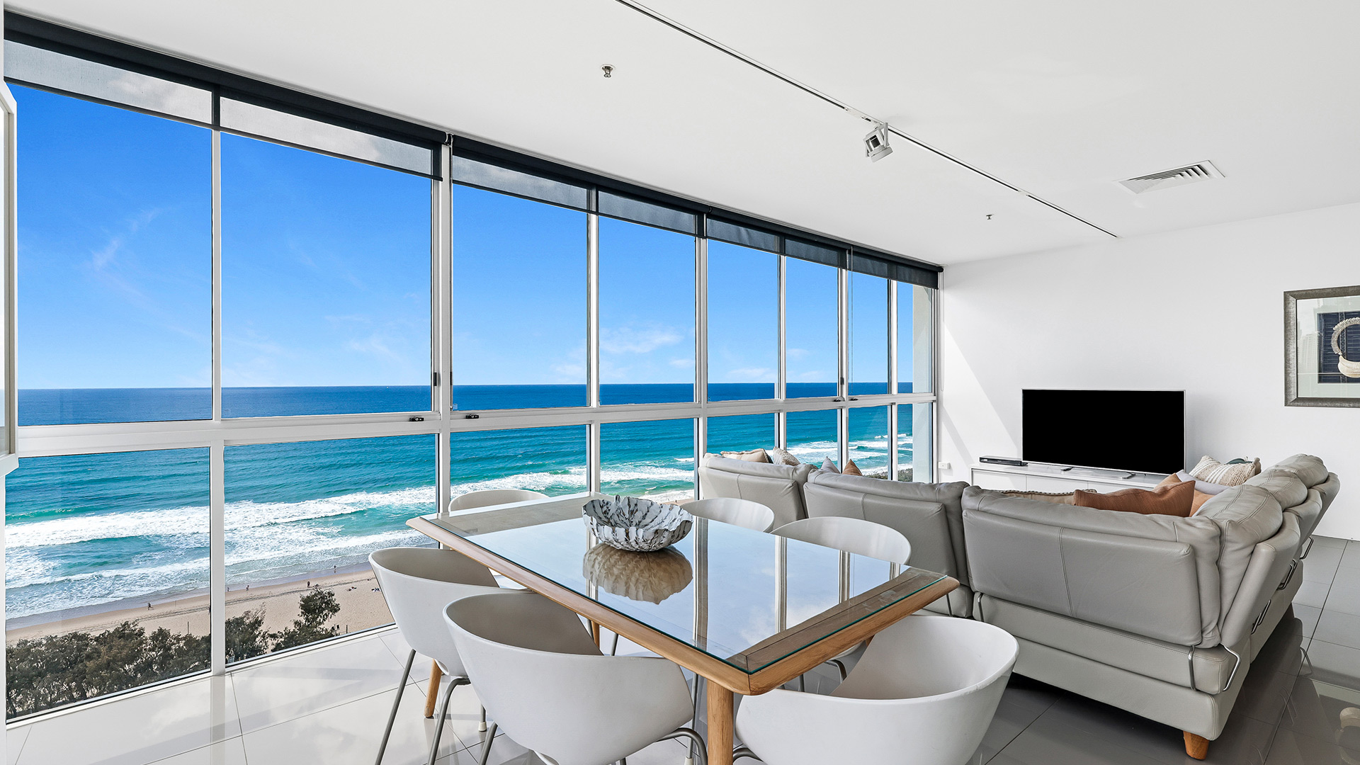 Dining and living area of 3 Bedroom Ocean View Apartment at ULTIQA Air on Broadbeach with sweeping ocean views.